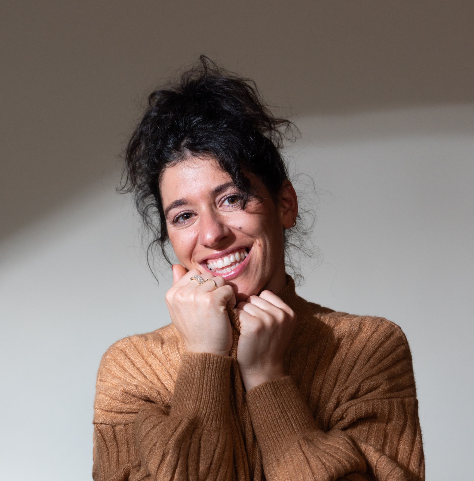 Yael Lanciano in a brown sweater